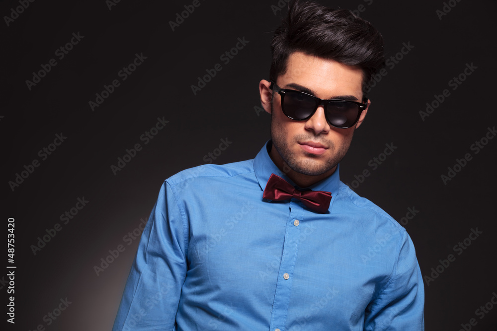 man wearing sunglasses and bow tie man wearing sunglasses and bow tie