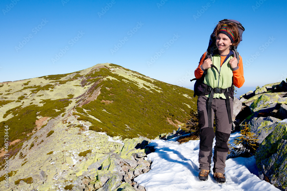 Hiker walking in autumn mountains Hiker walking in autumn mountains