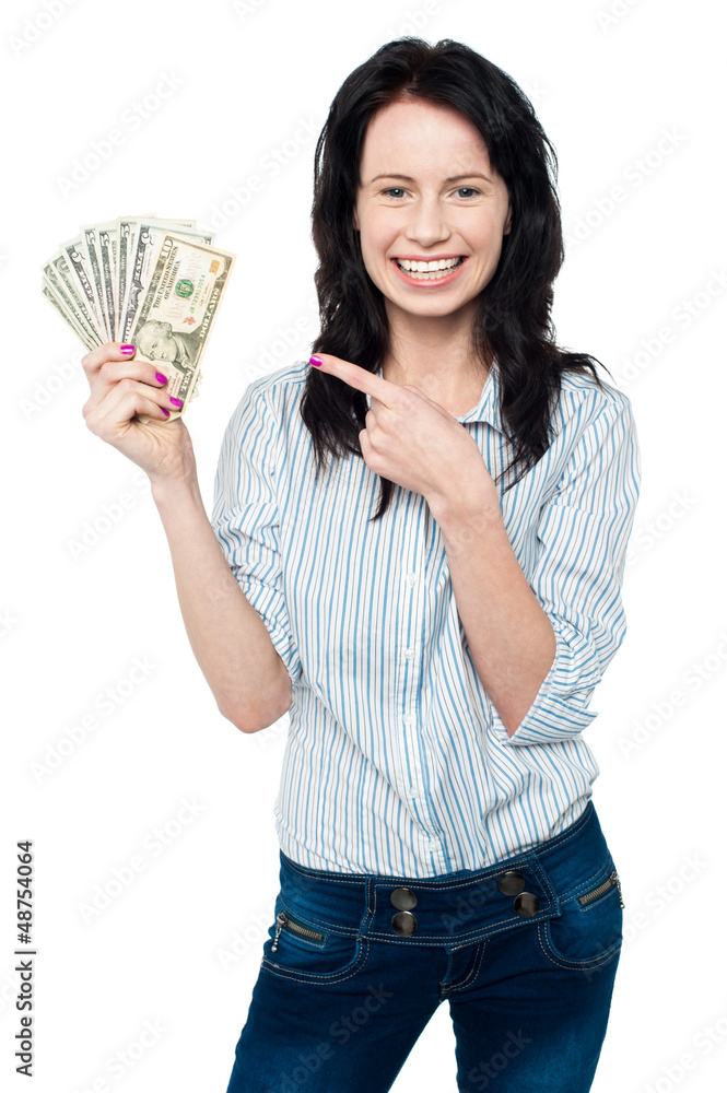 Pretty woman holding up fan of dollar notes Pretty woman holding up fan of dollar notes