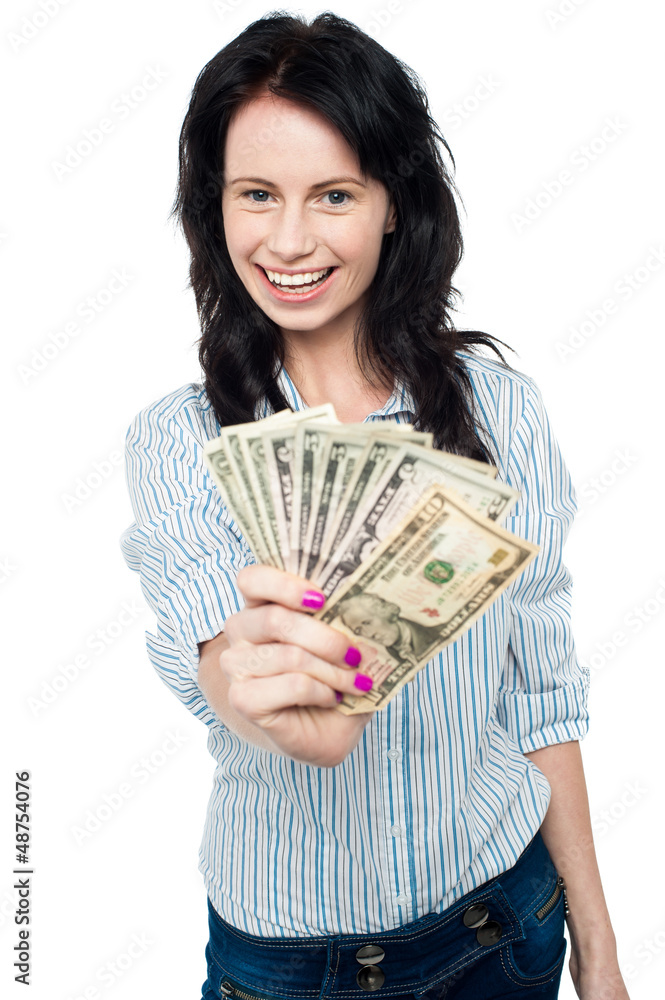 Young woman with dollars in her hands