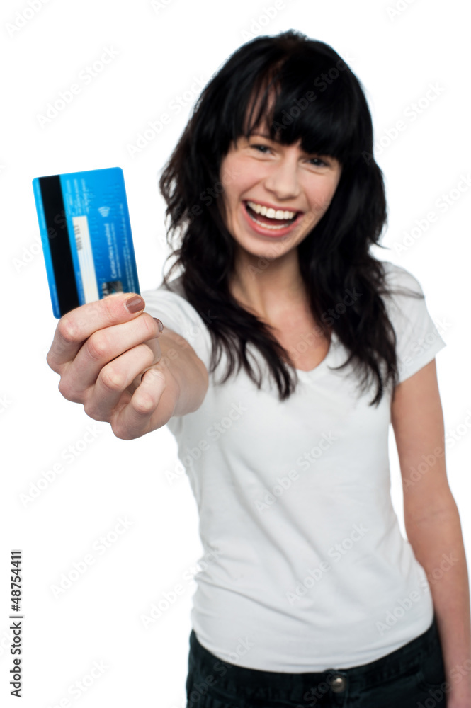 Joyous brunette showing her credit card to you Joyous brunette showing her credit card to you
