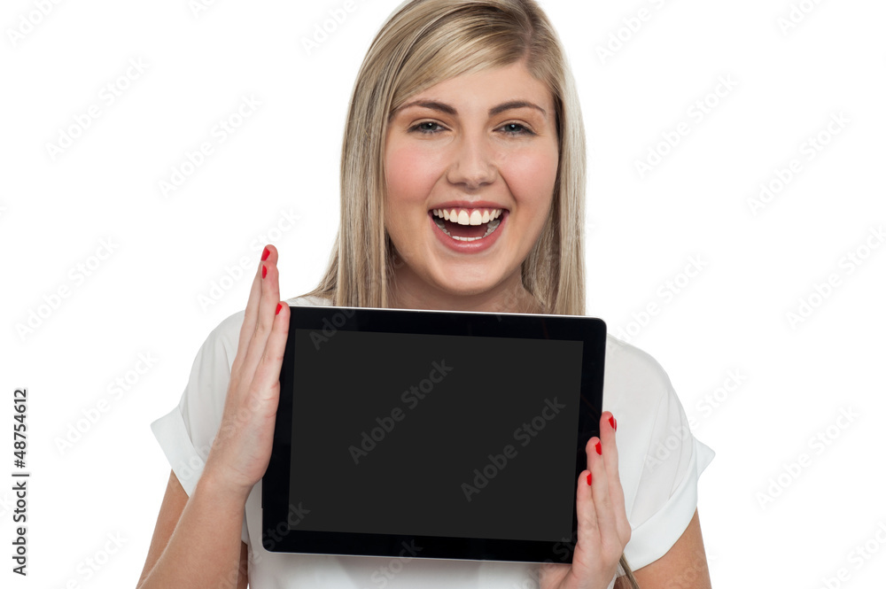 Active caucasian girl displaying tablet device Active caucasian girl displaying tablet device