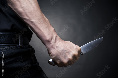 Hand with a knife