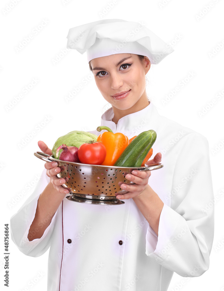Portrait of young woman chef with vegetables isolated on white Portrait of young woman chef with vegetables isolated on white