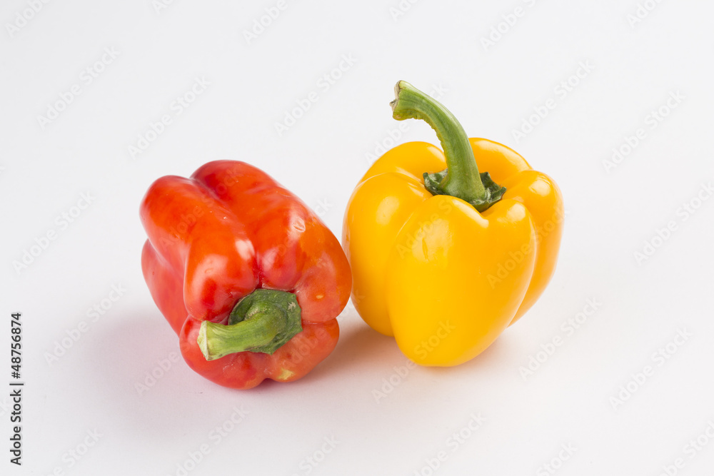Red and yellow sweet pepper on white background Red and yellow sweet pepper on white background