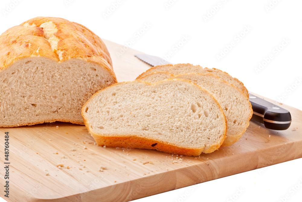 Bread on chopping board isolated on white Bread on chopping board isolated on white
