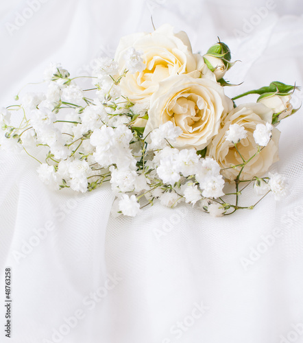 white roses on a white tulle