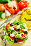 Greek vegetable salad with feta cheese, top view