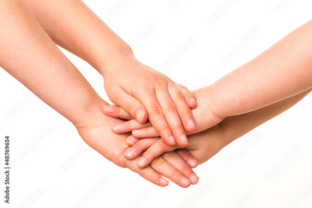 Two kids holding hands together.