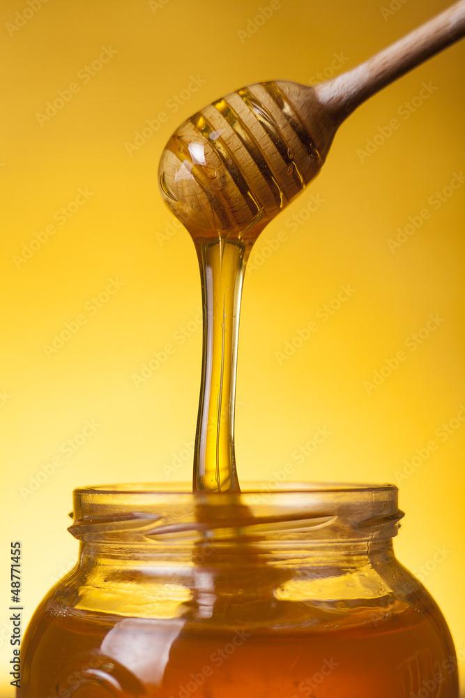 Close-up shot of flowing honey Close-up shot of flowing honey