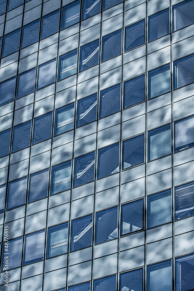Blue sky reflected in the glass building. Blue sky reflected in the glass building.