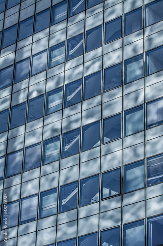 Blue sky reflected in the glass building.