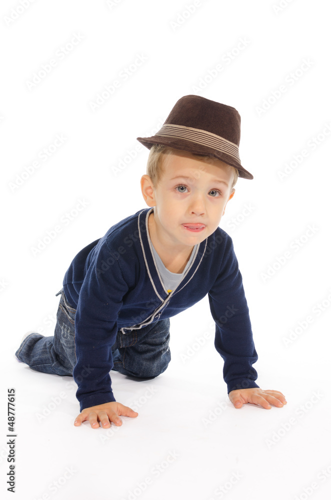 Portrait of child sitting on his knees and hands Portrait of child sitting on his knees and hands