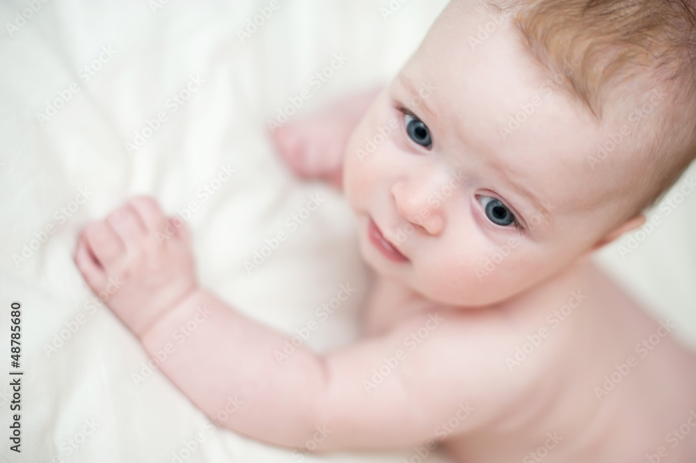 Little beautiful baby lying on a sofa Little beautiful baby lying on a sofa