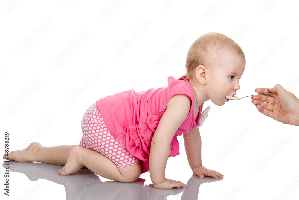 The creeping girl spoon-feed. isolated on white The creeping girl spoon-feed. isolated on white
