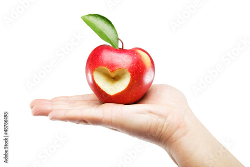 Woman's hand with an apple isolated on white background.