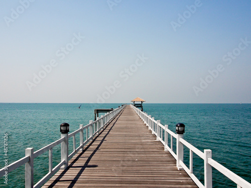 wooden bridge to the sea in sunny day © nui7711