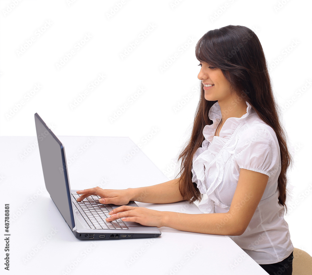 The beautiful business woman with the computer The beautiful business woman with the computer