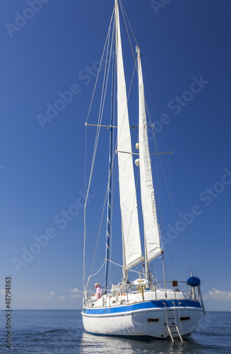 Happy Senior Couple On Front of a Sail Boat