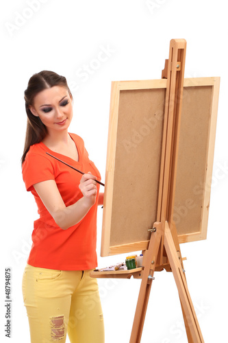 beautiful young woman painter at work, isolated on white