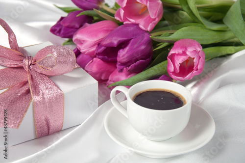 Fresh tulips with gift box and coffee breakfast