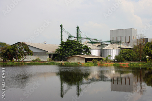 industrial, silo near pond.