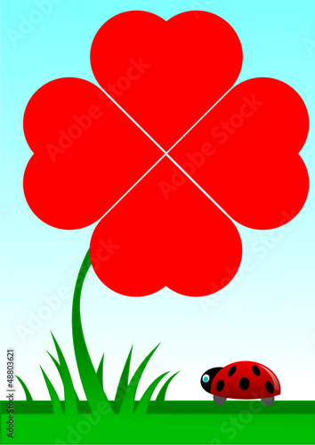 Beetle facing a red shamrock with four foils