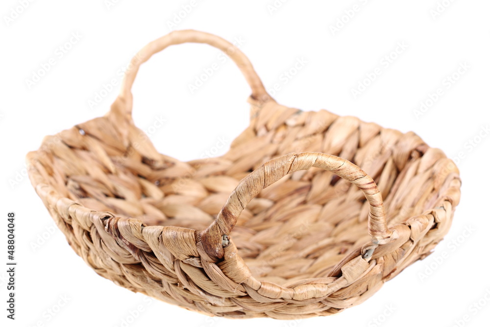 Obraz premium Empty wicker basket on a white background