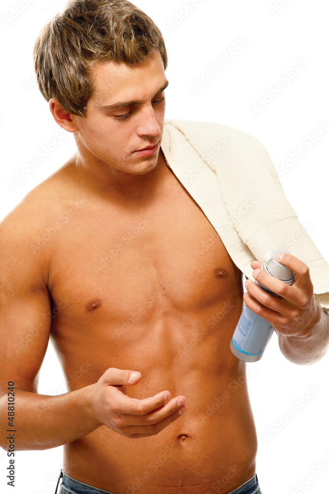 Closeup of a young man shaving , isolated on white background Closeup of a young man shaving , isolated on white background