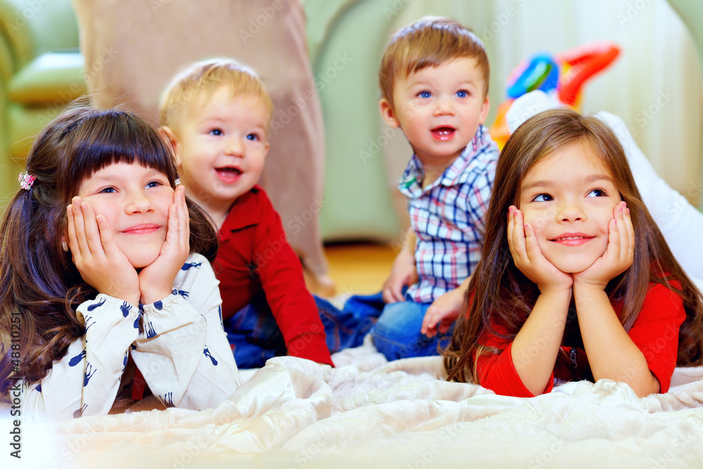 © Olesia Bilkei - group of attentive kids in nursery room