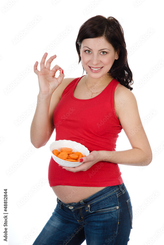 pregnant woman eating salad. isolated on white pregnant woman eating salad. isolated on white