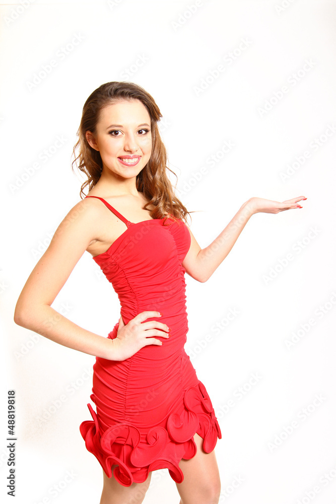 Beautiful girl in a red dress holding, makes palm up isolated Beautiful girl in a red dress holding, makes palm up isolated