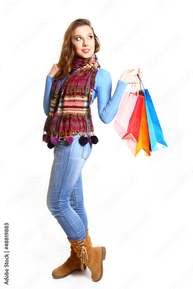 Lovely girl with shopping bags isolated on white background