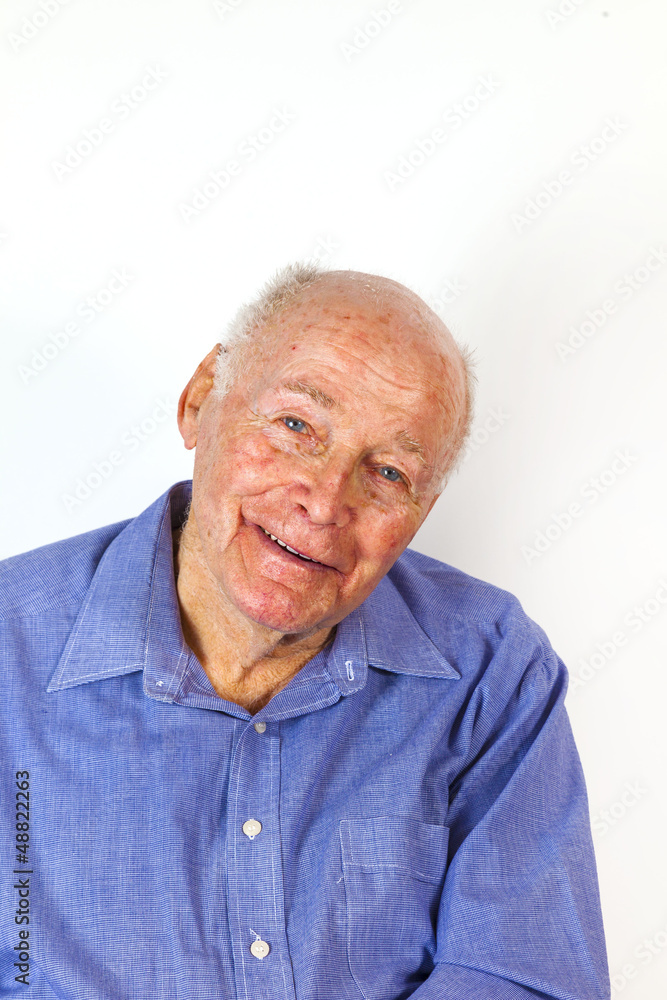 happy elderly man sitting in a chair happy elderly man sitting in a chair
