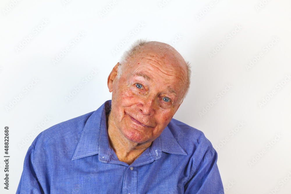 happy elderly man sitting in a chair happy elderly man sitting in a chair