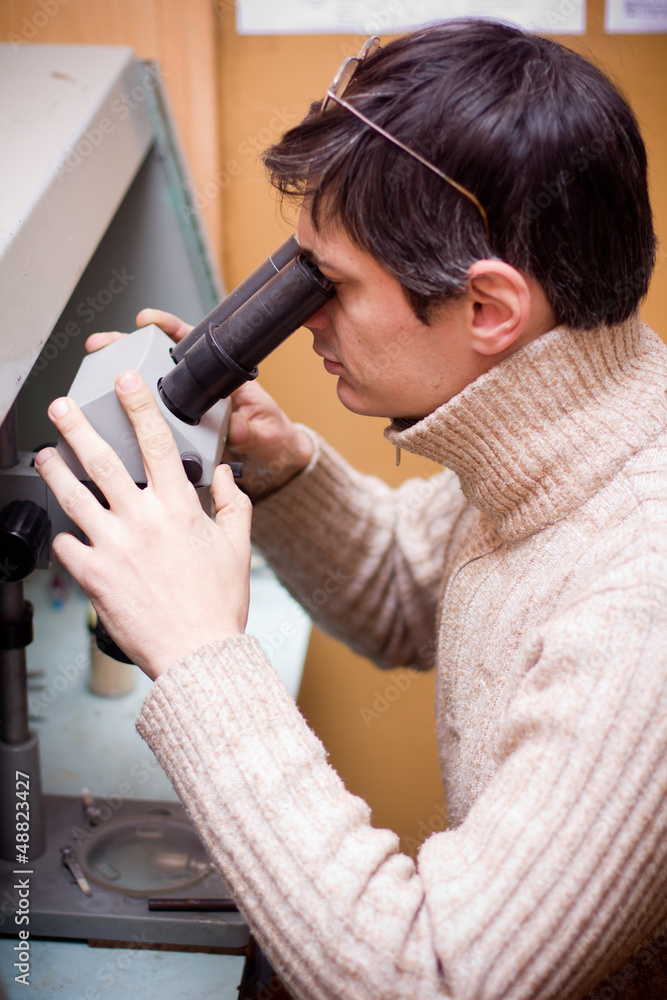 Fototapeta premium Scientist with microscope