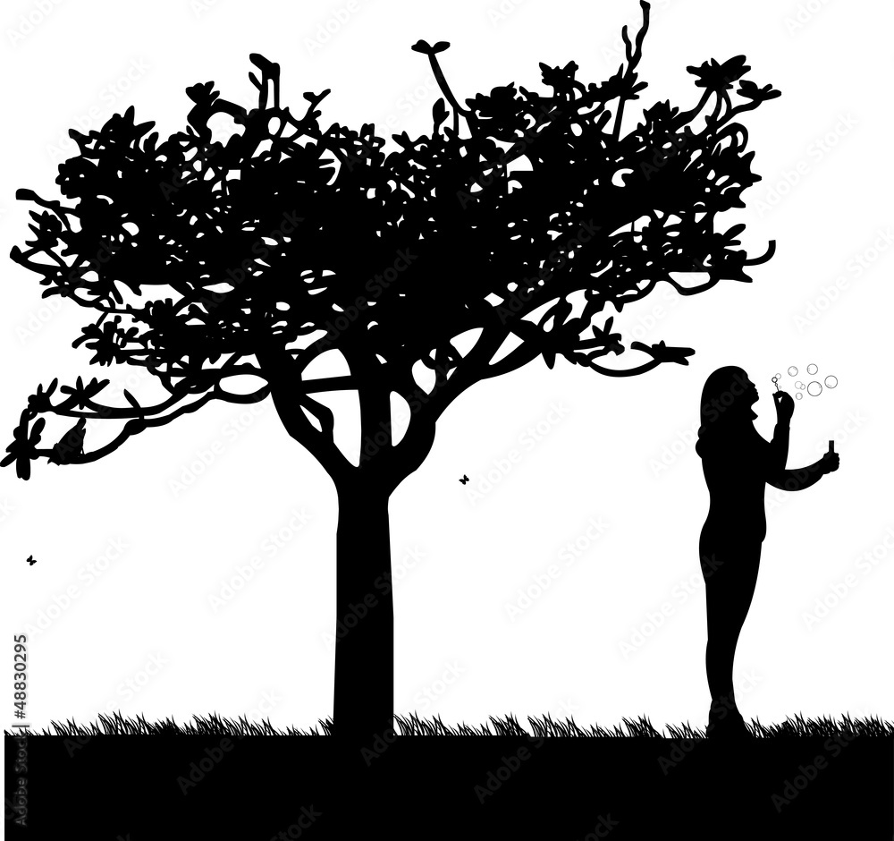 Young girl blowing soap bubbles in park silhouette Young girl blowing soap bubbles in park silhouette
