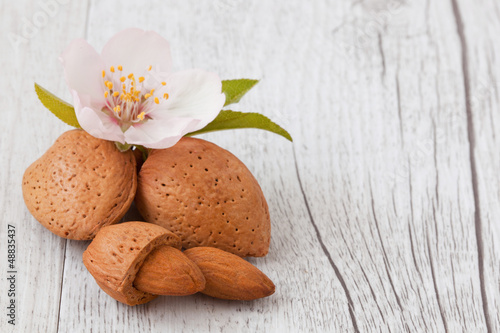 almonds on wooden background white