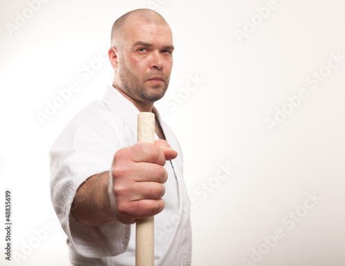 Aikido man with a stick