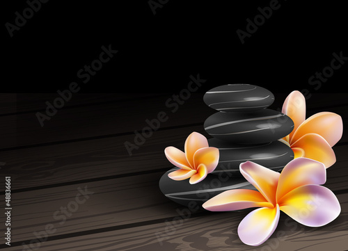 Spa concept zen stones and frangipani flowers