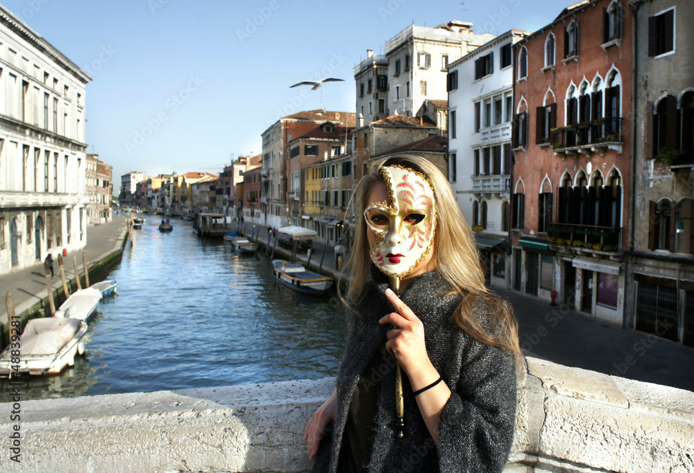 Fototapeta premium Woman in beautiful Venetian mask in Venice