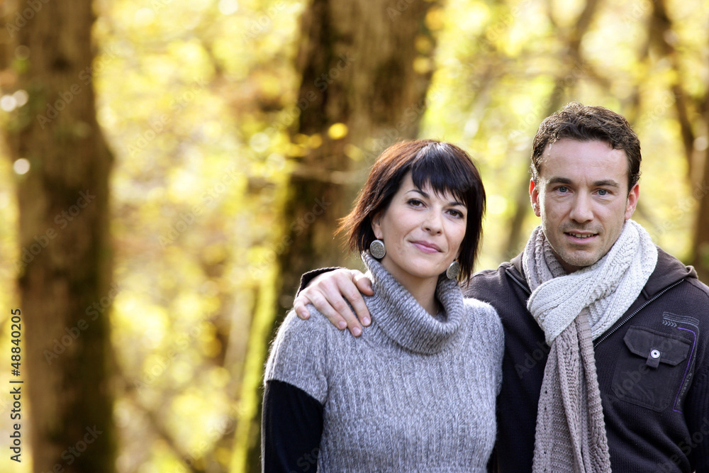 Couple strolling in the park together Couple strolling in the park together