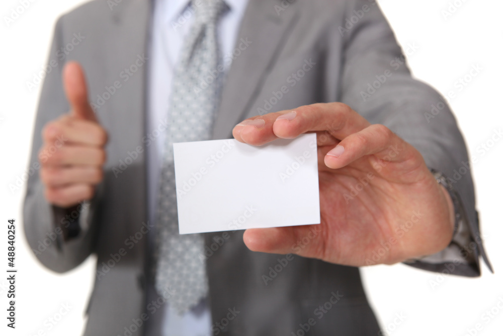 Executive with a blank businesscard Executive with a blank businesscard