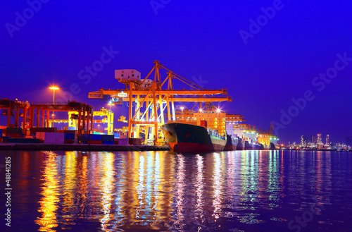 Industrial Container Cargo freight ship with working crane bridg