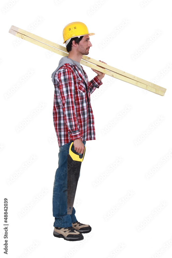Carpenter with two planks of wood and a hand-saw Carpenter with two planks of wood and a hand-saw