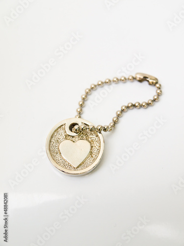 A miniature heart keychain isolated on white background