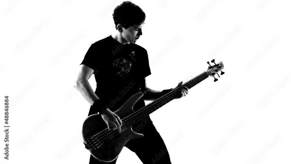 Playing guitar in a studio. Black and white video. Playing guitar in a studio. Black and white video.