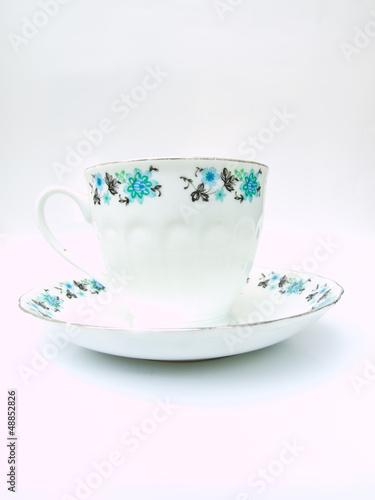 A  floral pattern tea cup isolated on white background