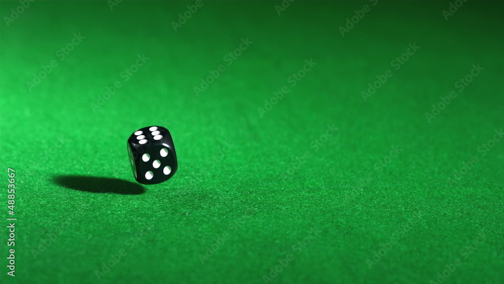 Red single die falling in super slow motion Red single die falling in super slow motion