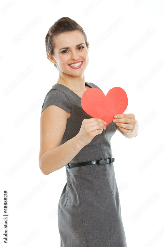 Smiling young woman showing heart shaped postcard Smiling young woman showing heart shaped postcard